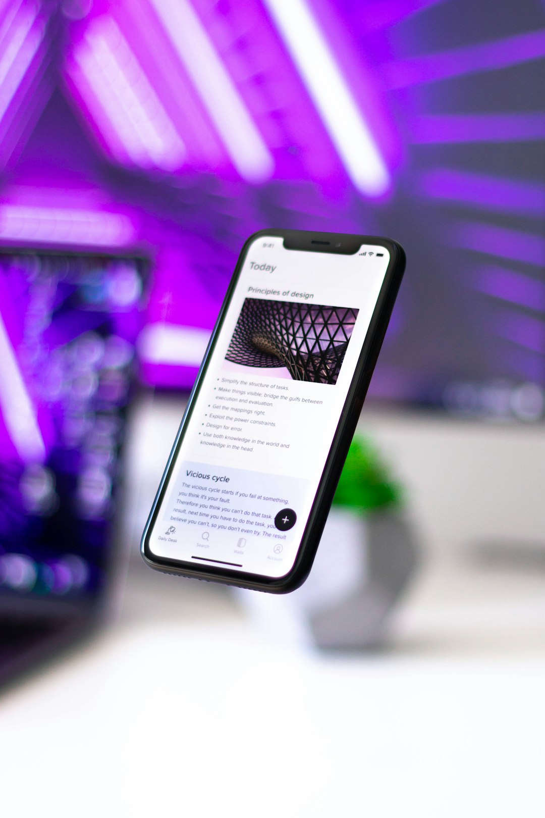 services-01 Floating iPhone XR with the Walling App open.